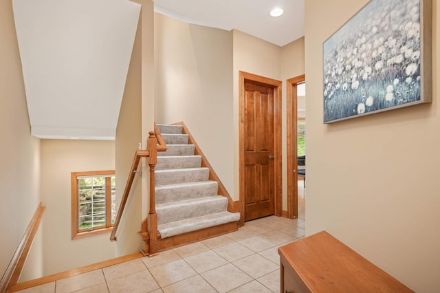 6507 Orchard Ridge Trl, Woodbury, MN 55129 - stairs featuring tile patterned floors, healthy amount of natural light, and recessed lighting