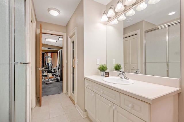 6507 Orchard Ridge Trl, Woodbury, MN 55129 - bathroom featuring vanity, tile patterned flooring, and a shower stall