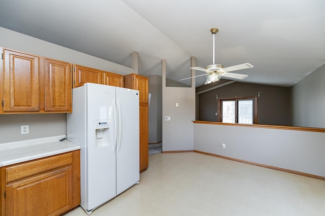 2625 Westview Ln NW, Rochester, MN 55901 - kitchen with light countertops, white fridge with ice dispenser, a ceiling fan, light floors, and vaulted ceiling