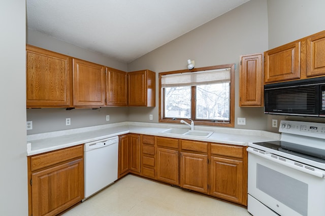 2625 Westview Ln NW, Rochester, MN 55901 - kitchen featuring light countertops, a sink, light floors, lofted ceiling, and white appliances