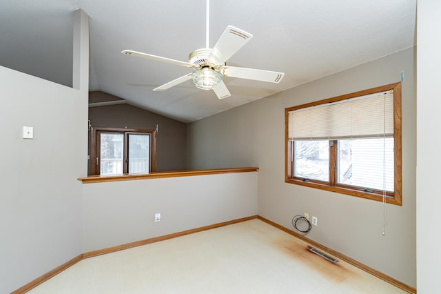 2625 Westview Ln NW, Rochester, MN 55901 - unfurnished room with ceiling fan, baseboards, vaulted ceiling, and visible vents