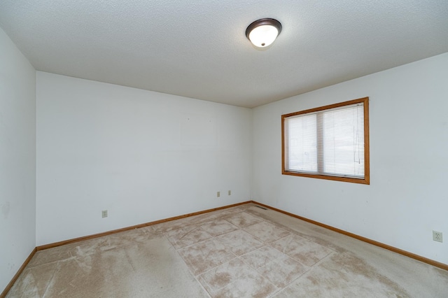 2625 Westview Ln NW, Rochester, MN 55901 - spare room featuring baseboards, light colored carpet, and a textured ceiling
