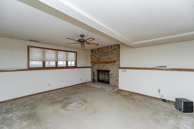 2625 Westview Ln NW, Rochester, MN 55901 - unfurnished living room with a ceiling fan, a brick fireplace, baseboards, and a textured ceiling