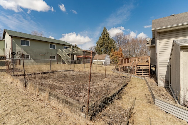 2625 Westview Ln NW, Rochester, MN 55901 - view of yard featuring stairway, fence, and a wooden deck