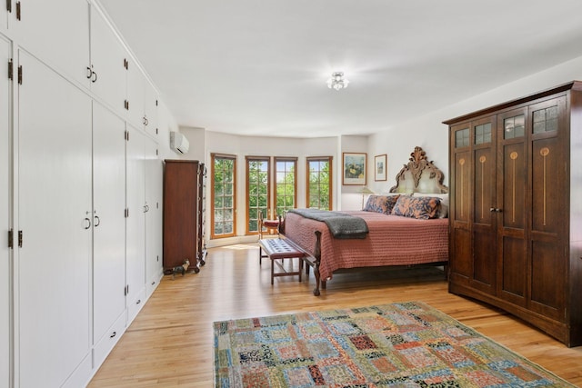 2924 Farwell Ave, Minneapolis, MN 55411 - bedroom with light wood-type flooring and a wall mounted AC