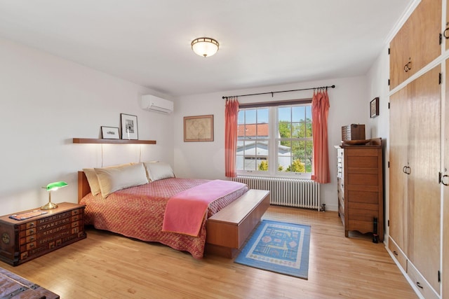 2924 Farwell Ave, Minneapolis, MN 55411 - bedroom featuring radiator heating unit, a wall mounted air conditioner, and light wood-style flooring