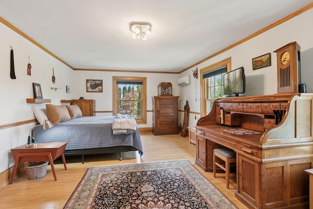 2924 Farwell Ave, Minneapolis, MN 55411 - bedroom with an AC wall unit, crown molding, light wood finished floors, and baseboards