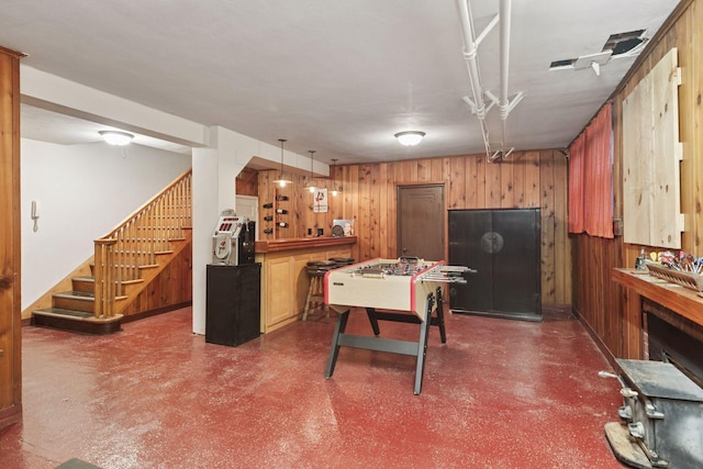 2924 Farwell Ave, Minneapolis, MN 55411 - kitchen featuring wooden walls, concrete floors, and decorative light fixtures
