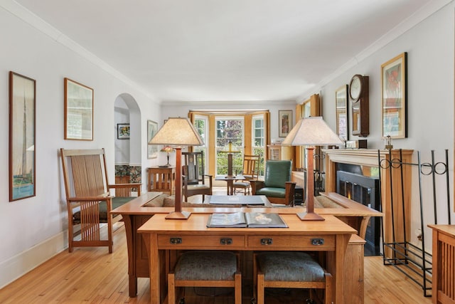 2924 Farwell Ave, Minneapolis, MN 55411 - living area with ornamental molding, light wood finished floors, arched walkways, and baseboards