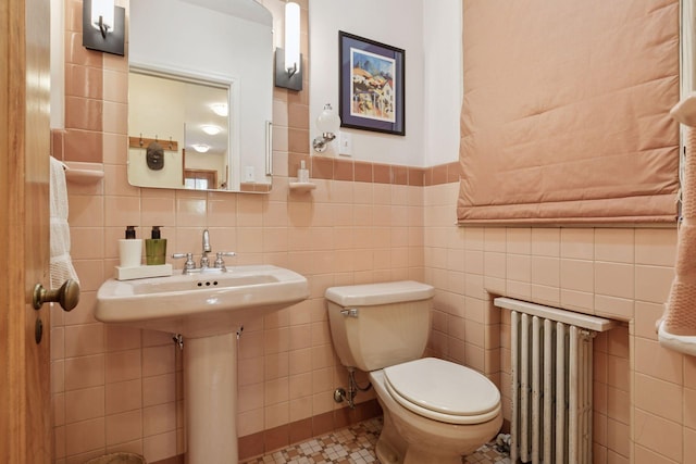 2924 Farwell Ave, Minneapolis, MN 55411 - bathroom with radiator, tile walls, and toilet