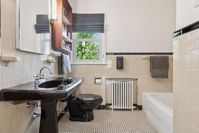 2924 Farwell Ave, Minneapolis, MN 55411 - full bath with radiator, toilet, a bathtub, tile patterned floors, and tile walls