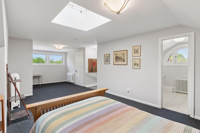2924 Farwell Ave, Minneapolis, MN 55411 - bedroom with radiator heating unit, dark carpet, multiple windows, and vaulted ceiling