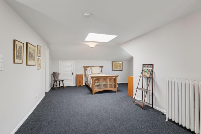 2924 Farwell Ave, Minneapolis, MN 55411 - bedroom featuring radiator heating unit, a skylight, baseboards, dark colored carpet, and lofted ceiling