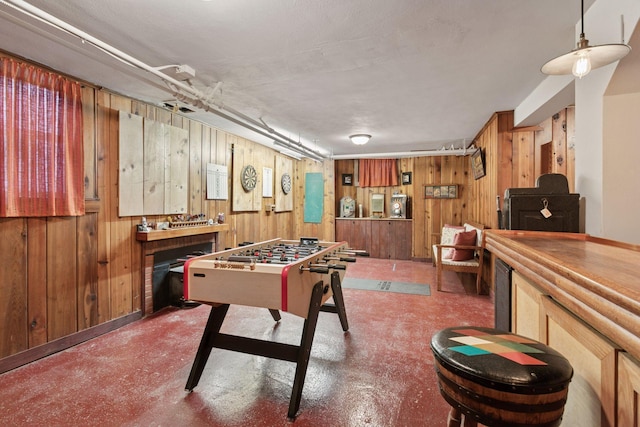 2924 Farwell Ave, Minneapolis, MN 55411 - rec room with wooden walls and concrete floors