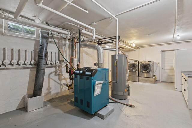 2924 Farwell Ave, Minneapolis, MN 55411 - basement featuring washer and clothes dryer, gas water heater, and freestanding refrigerator