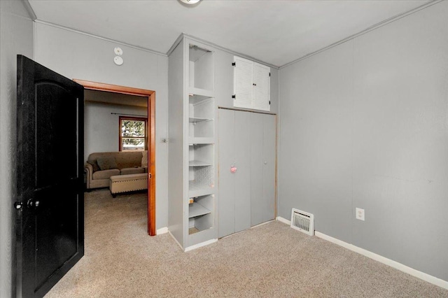 carpeted bedroom with baseboards
