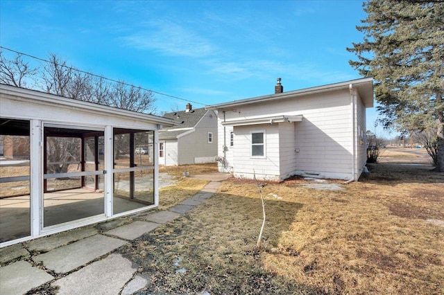 rear view of house with a sunroom