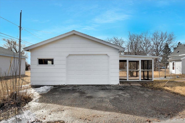 view of front of property with an outbuilding and a garage