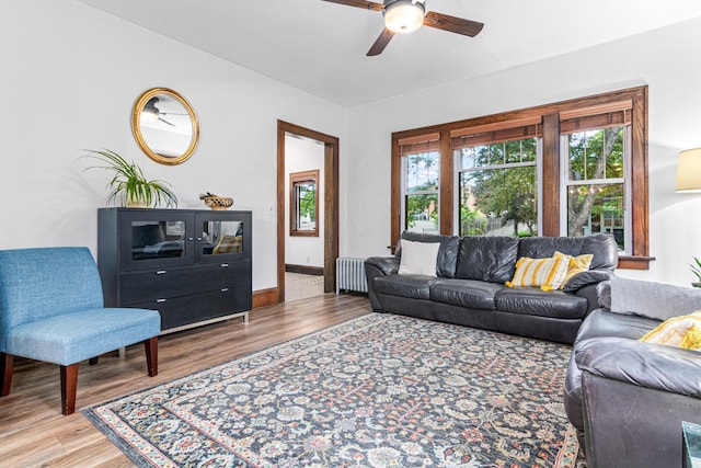 1597 James Ave, Saint Paul, MN 55105 - living area with radiator heating unit, a ceiling fan, and wood finished floors