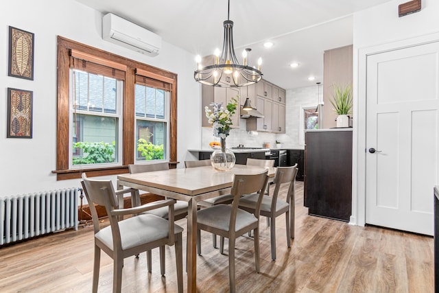 1597 James Ave, Saint Paul, MN 55105 - dining area featuring radiator heating unit, a wall mounted AC, a chandelier, light wood-style flooring, and recessed lighting