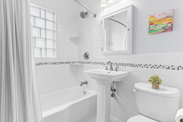 1597 James Ave, Saint Paul, MN 55105 - full bath featuring shower / bathtub combination with curtain, toilet, tile walls, and a wainscoted wall