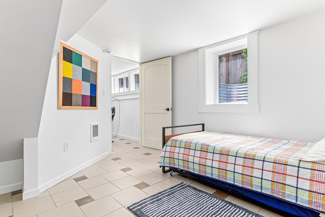 1597 James Ave, Saint Paul, MN 55105 - bedroom featuring baseboards, multiple windows, and light tile patterned floors