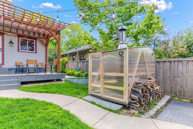 1597 James Ave, Saint Paul, MN 55105 - view of yard with a greenhouse, a wooden deck, an outbuilding, and a pergola