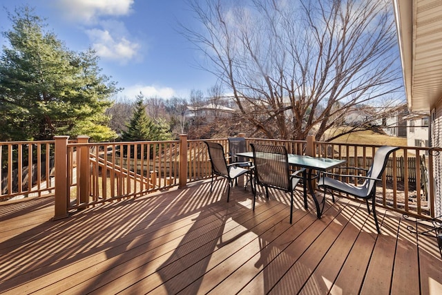 deck with outdoor dining area