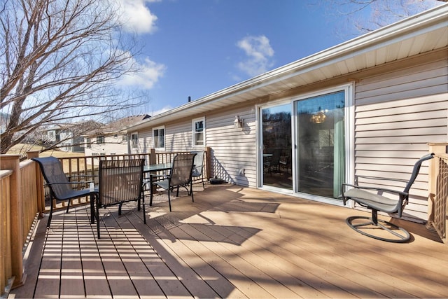 deck with outdoor dining area