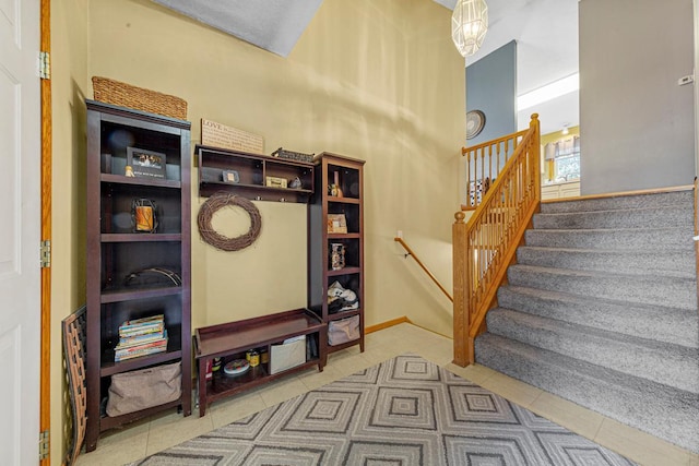 stairway featuring tile patterned flooring