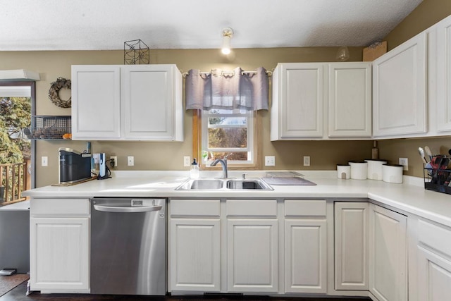 kitchen featuring white cabinetry, a sink, light countertops, and dishwasher