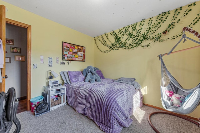 carpeted bedroom with baseboards