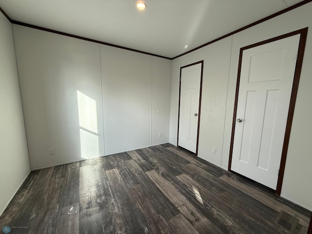 1224 15th Ave N # 45, Moorhead, MN 56560 - unfurnished bedroom with ornamental molding and wood finished floors
