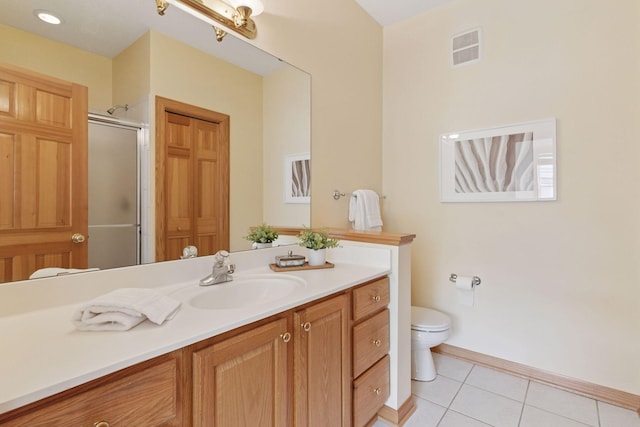 13 4th Ave N Unit 106, Minneapolis, MN 55401 - full bath featuring toilet, vanity, tile patterned flooring, a stall shower, and baseboards