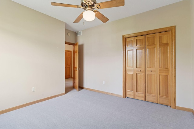 13 4th Ave N Unit 106, Minneapolis, MN 55401 - unfurnished bedroom with light colored carpet, baseboards, a ceiling fan, and a closet
