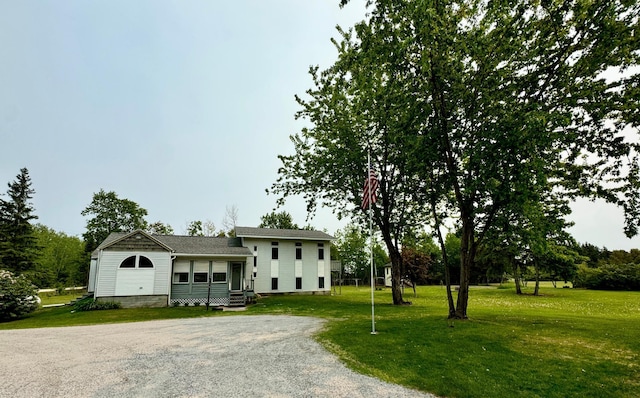 57058 350th St, Warroad, MN 56763 - split level home featuring a front yard and driveway