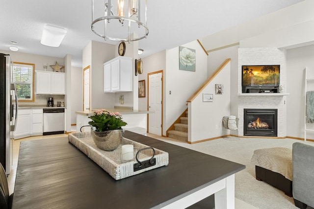 5633 200th St W Unit 1102, Farmington, MN 55024 - living area featuring a chandelier, a fireplace, and stairway