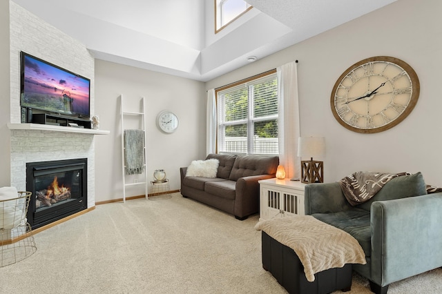 5633 200th St W Unit 1102, Farmington, MN 55024 - living room featuring carpet flooring, a fireplace, plenty of natural light, and a towering ceiling