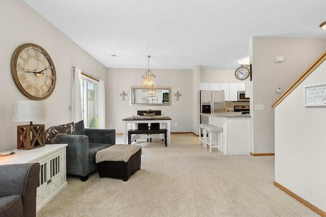 5633 200th St W Unit 1102, Farmington, MN 55024 - living area featuring light carpet, a chandelier, and baseboards