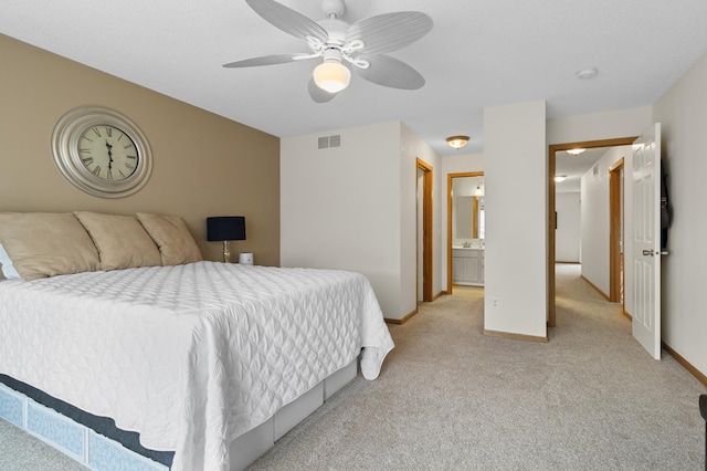 5633 200th St W Unit 1102, Farmington, MN 55024 - bedroom featuring light carpet, baseboards, and a ceiling fan