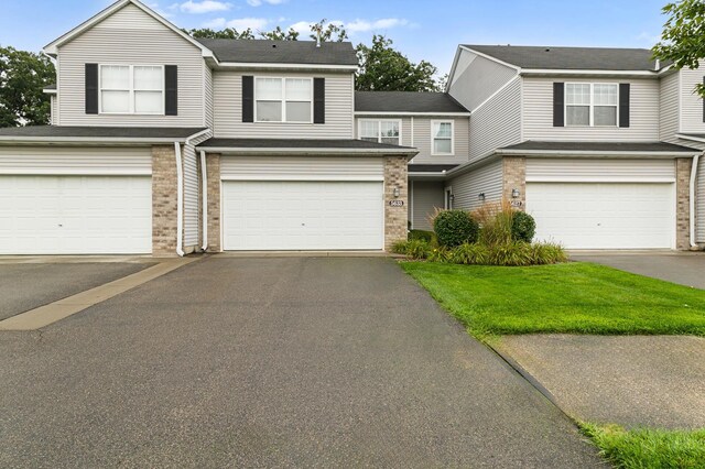 5633 200th St W Unit 1102, Farmington, MN 55024 - multi unit property featuring an attached garage, brick siding, and asphalt driveway