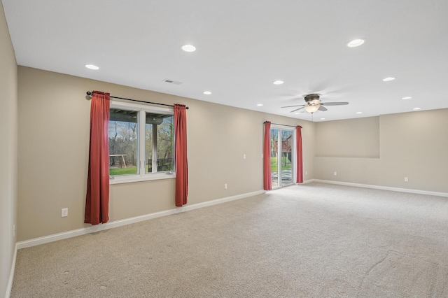 unfurnished room featuring visible vents, a ceiling fan, light colored carpet, and recessed lighting