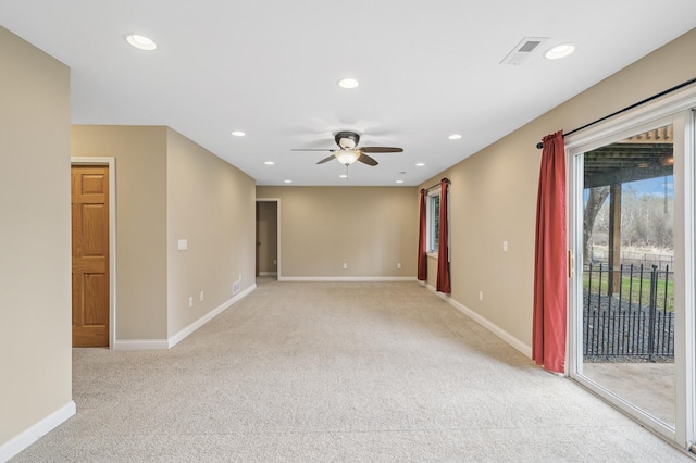 empty room featuring baseboards, recessed lighting, light carpet, and ceiling fan
