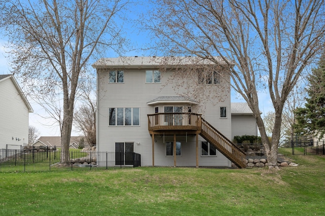 back of property with a yard, stairs, a wooden deck, and a fenced backyard