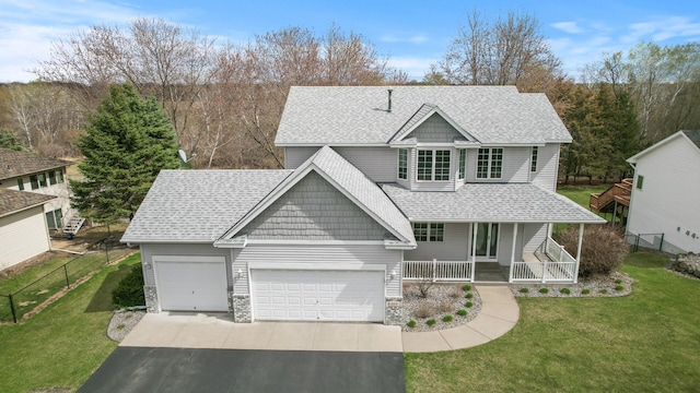 view of front of property featuring a porch, a front lawn, a garage, aphalt driveway, and roof with shingles