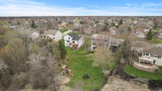 birds eye view of property with a residential view