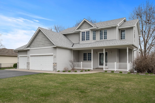 traditional-style home with a porch, driveway, a garage, and a shingled roof
