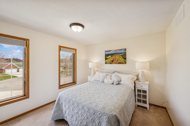 bedroom featuring baseboards and carpet floors