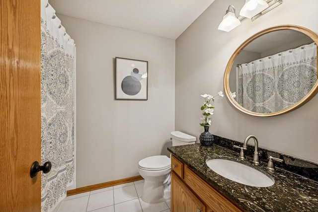 full bath featuring tile patterned floors, vanity, toilet, and baseboards