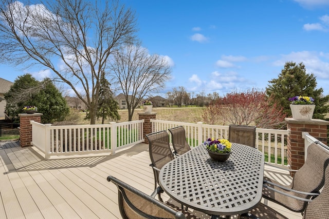 wooden deck featuring outdoor dining space